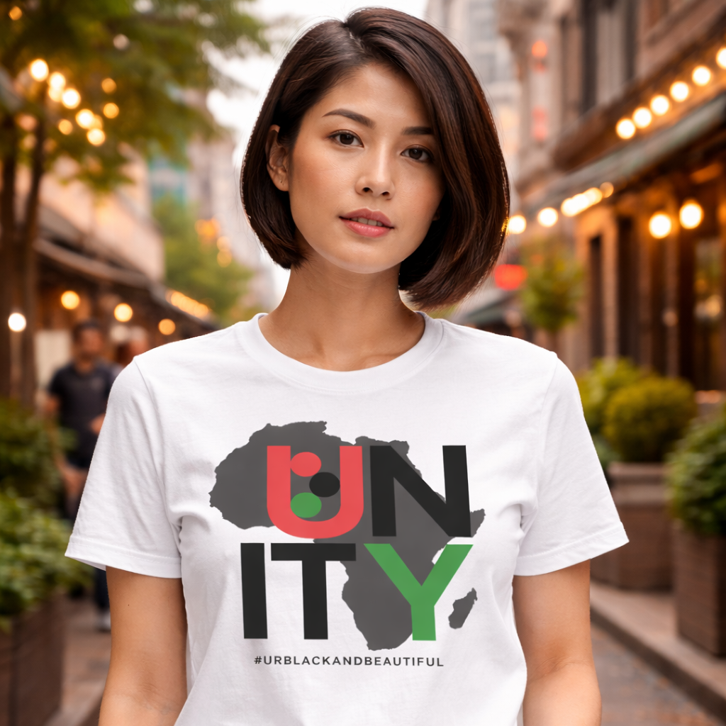 Woman wearing a white t-shirt with a graphic design on a city street.