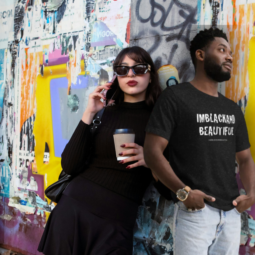 Two people standing against a colorful graffiti wall.