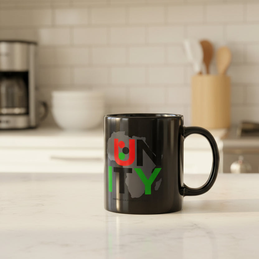 Black mug with a colorful UNITY design on a kitchen counter