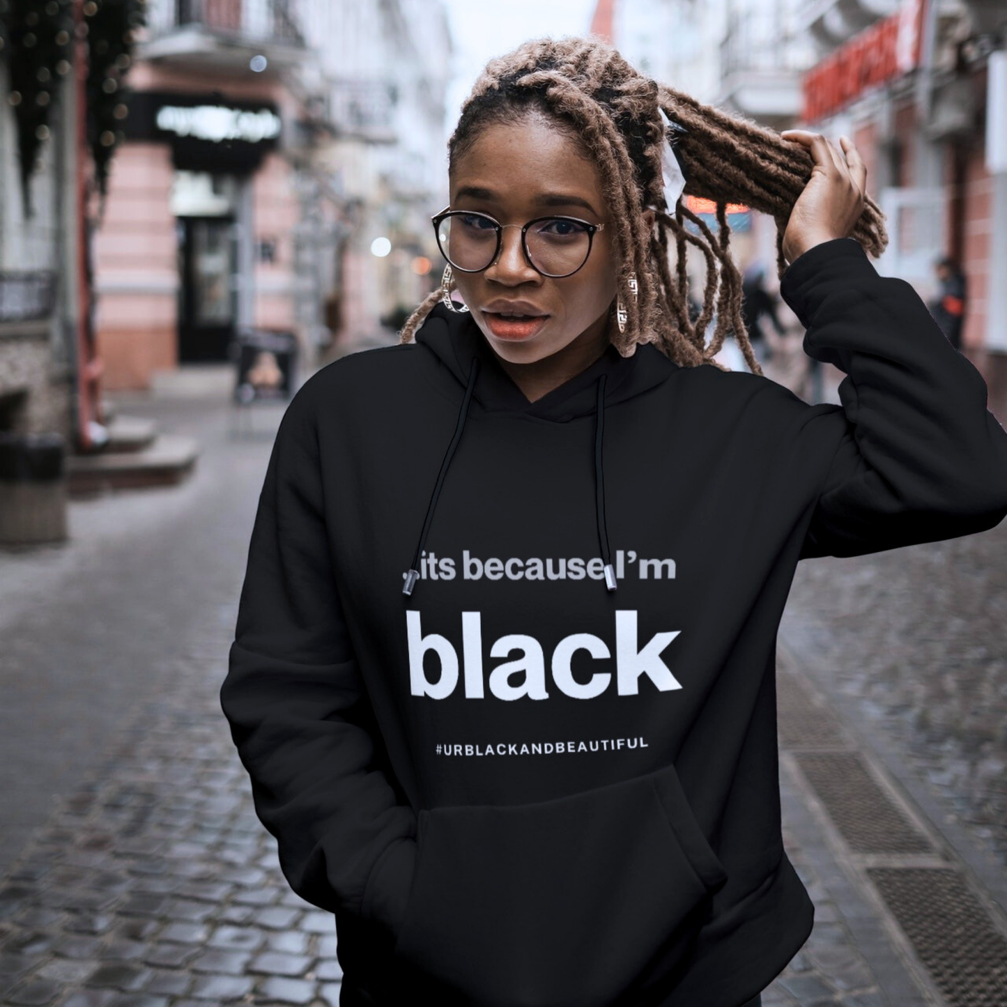 African sister stating its because she's BLACK  a black hoodie 