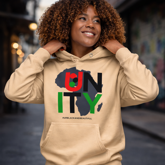 Person wearing a beige hoodie with 'UNITY' design in multiple colors.