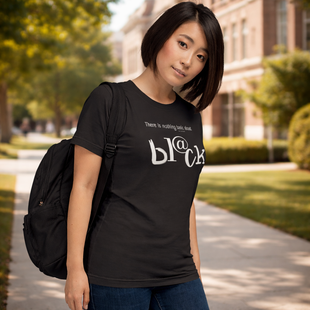 Woman wearing a dark grey t-shirt with text, standing outdoors on a path.