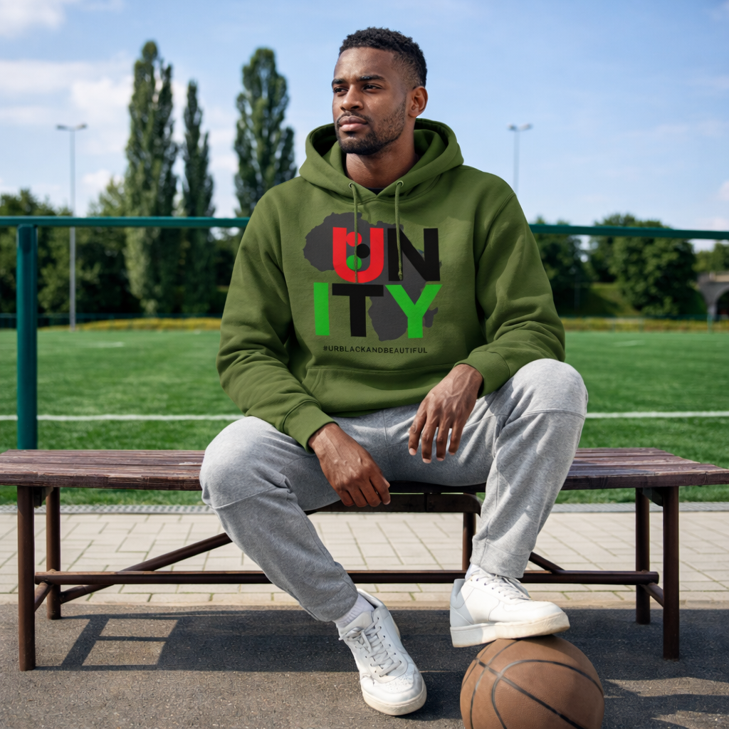 Man sitting on a bench wearing a green hoodie with 'UNITY' printed on it, outdoors.