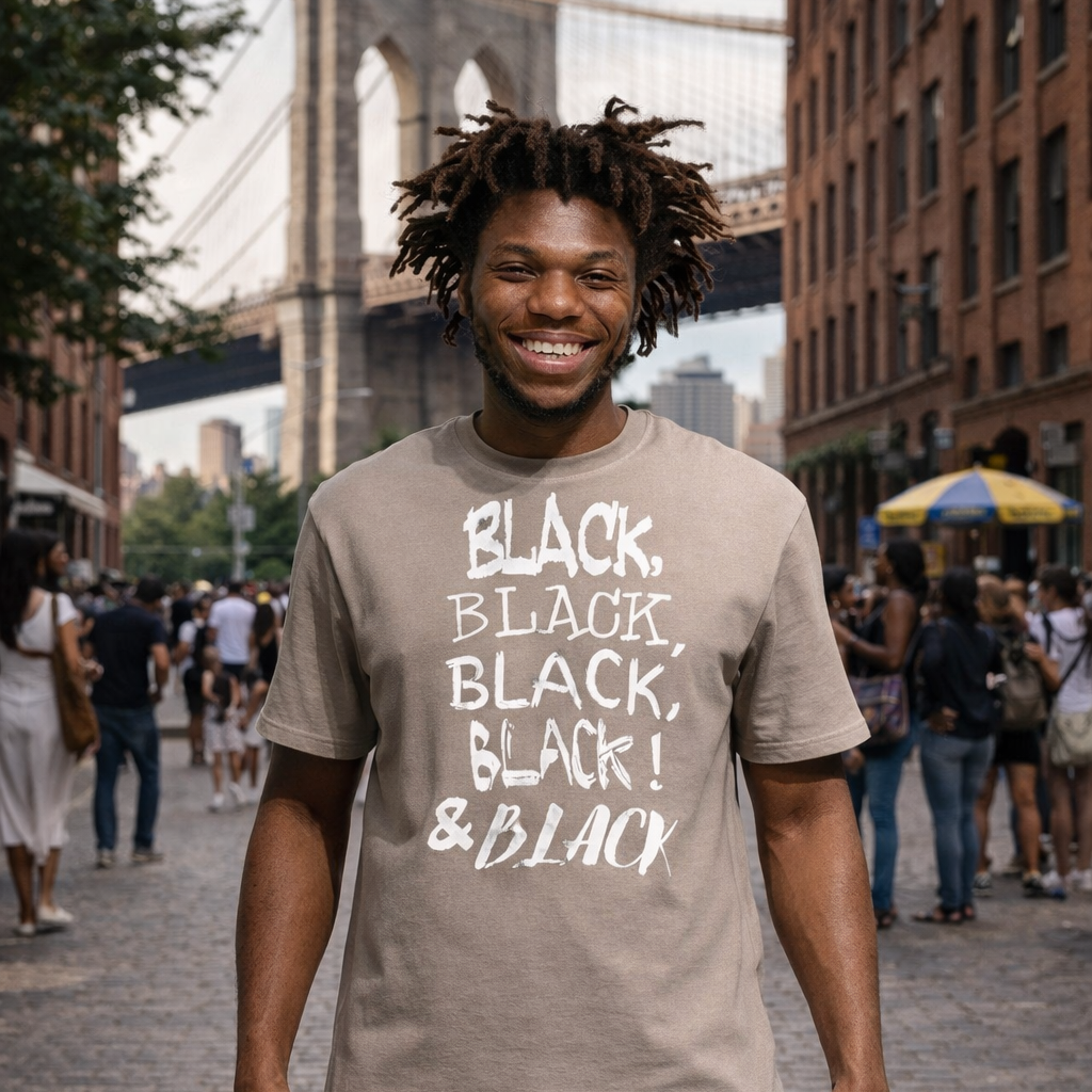 Black man wearing a pebble color  t-shirt with the Brooklyn Bridge in the background.