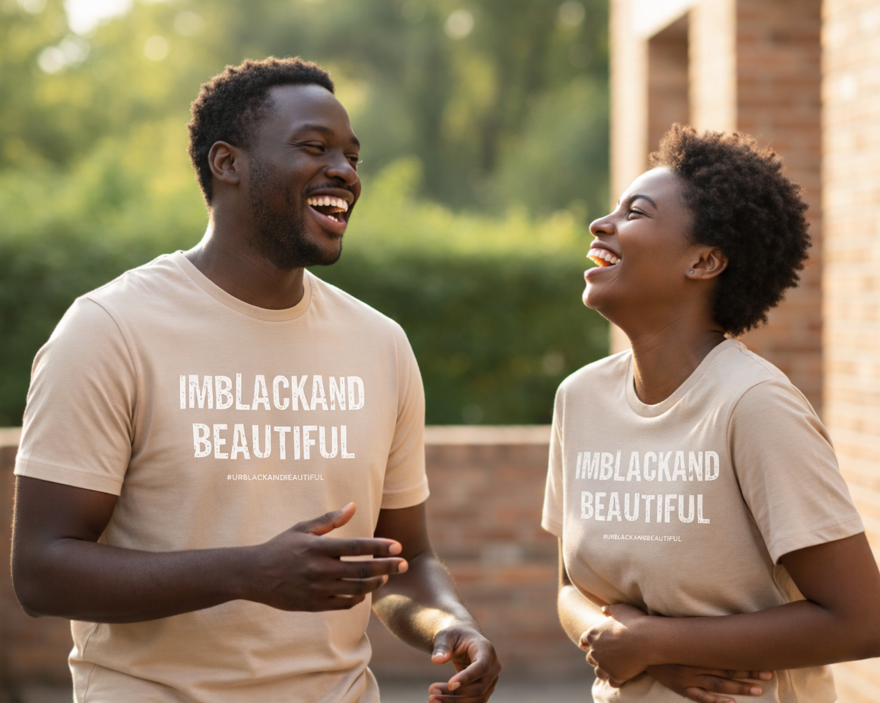 Two people wearing tan colored  'IMBLACKAND BEAUTIFUL' t-shirts outdoors.